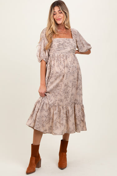 Beige floral pleated bodice maternity midi dress for stylish and comfortable expectant mothers.