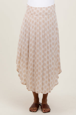 Beige damask print maternity midi skirt with smocked waistband, stylish and comfortable for expecting mothers.