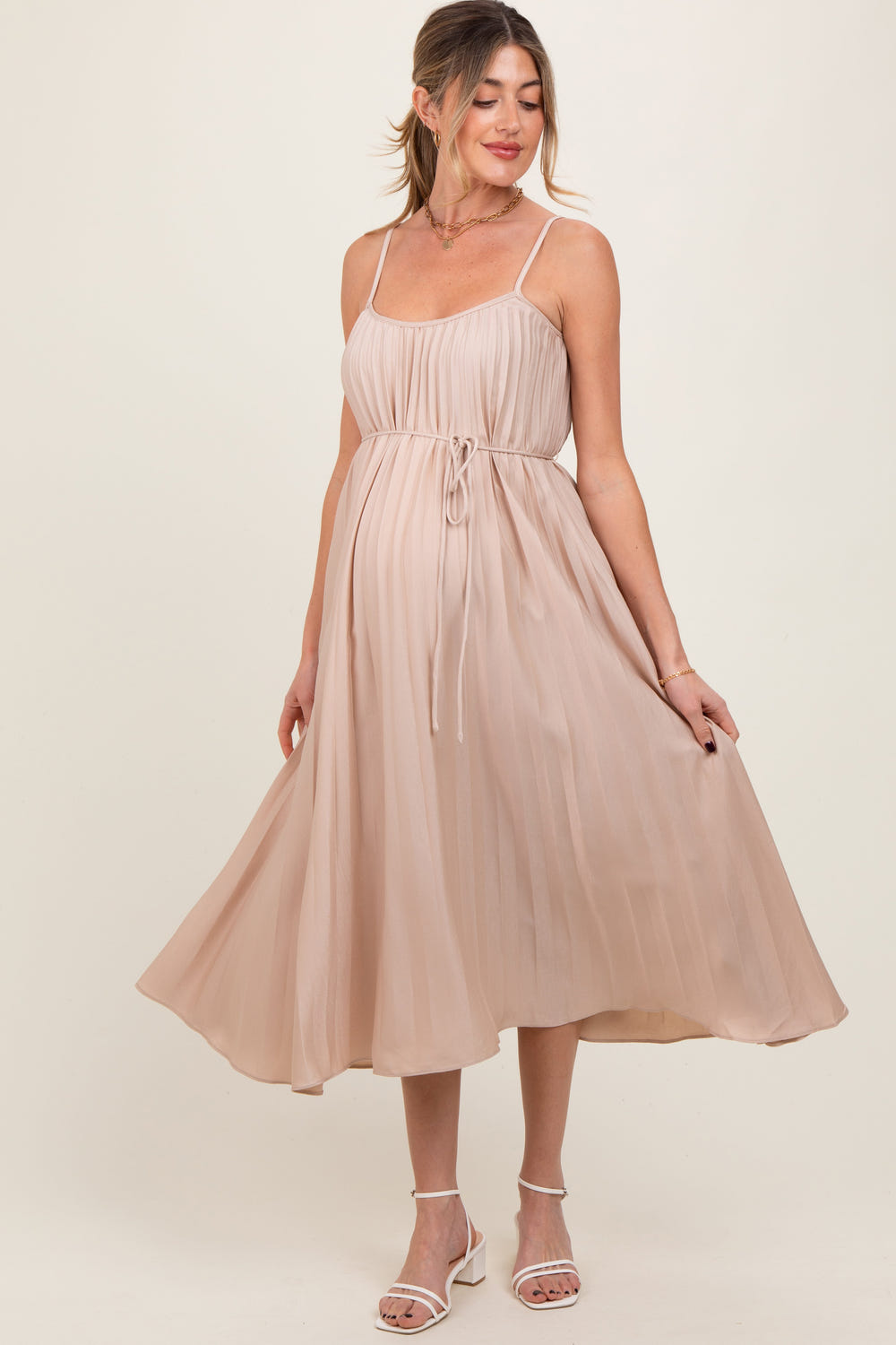 Beige pleated sash tie maternity midi dress for stylish and comfortable pregnancy wear.