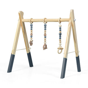 Portable wooden baby gym with teething toys, perfect for newborn exercise and play, angled view.