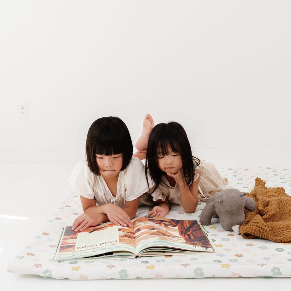 Playful Posies Vegan Leather Mat for babies, featuring a colorful floral design, perfect for playtime and tummy time.