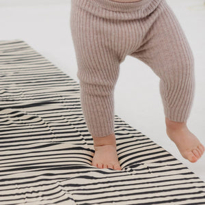 Bold Stripe Organic Cotton Mat at a 15-degree angle, perfect for baby playtime and eco-friendly comfort.