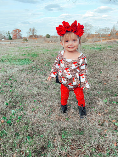 Leopard Santa ruffle romper for babies, festive holiday clothing, cute and stylish infant apparel.
