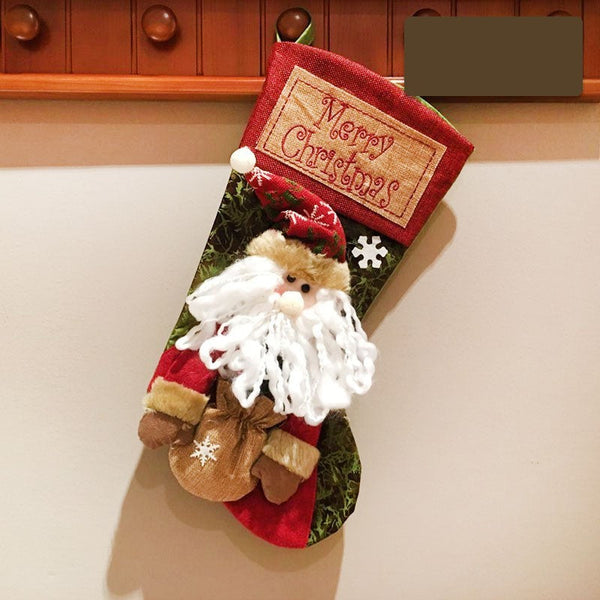 Christmas stocking featuring Santa and snowman decor, perfect for festive baby room decorations.