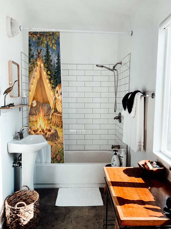 Moonlit Forest Camp Camping shower curtain hanging on the rod over a white bathtub