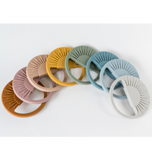 Sage Sunburst Teething Toy at angle 6, perfect for soothing baby's gums and promoting sensory development.