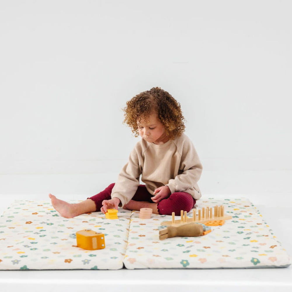 Playful Posies Organic Cotton Mat for babies, featuring a colorful floral design, perfect for playtime and tummy time.