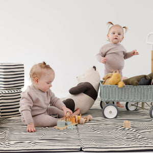 Bold Stripe Organic Cotton Mat for babies, perfect for playtime, shown at a 10-degree angle.
