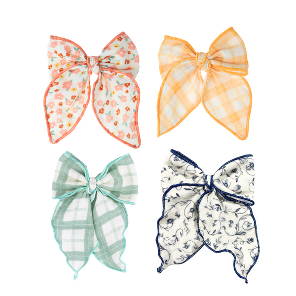 Fable Bow in Fern Plaid, mid-size accessory for babies, shown from angle 2. Perfect for seasonal wear.