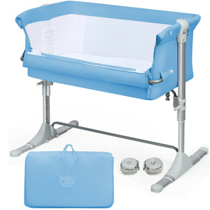 Portable baby bed side sleeper bassinet crib with carrying bag, angled view for travel convenience.