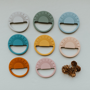 Sage Sunburst Teething Toy in angle 11, perfect for soothing baby's gums and promoting sensory development.