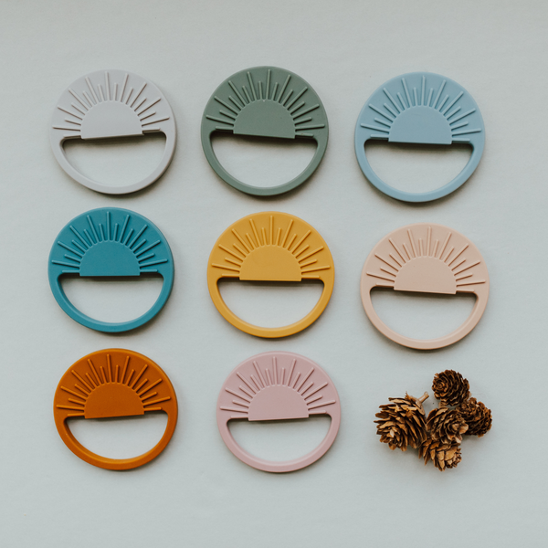 Sage Sunburst Teething Toy in angle 11, perfect for soothing baby's gums and promoting sensory development.