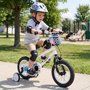 12-inch kids bike with training wheels for ages 3-4, white with street art design, angled view.