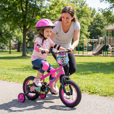 12-inch pink kids bike with training wheels for ages 3-4, featuring street art design. Perfect for little riders!