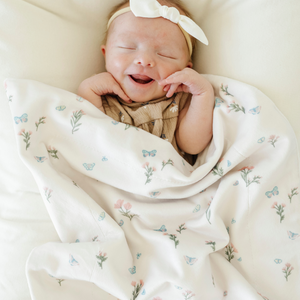 Soft Minky Stretch Receiving Blankets in various colors, perfect for swaddling and keeping your baby cozy.