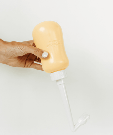 "Peri bottle for postpartum care, designed for comfort and hygiene after childbirth."