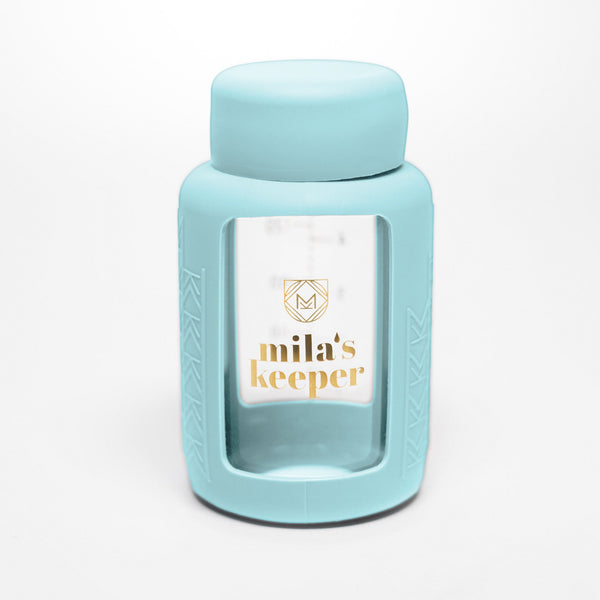 Set of 2 glass breast milk bottles at angle 46, perfect for safe and stylish breast milk storage.