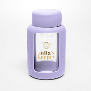 Set of 2 glass breast milk bottles at angle 54, perfect for safe and stylish breast milk storage.