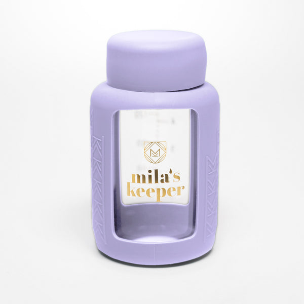 Set of 2 glass breast milk bottles at angle 54, perfect for safe and stylish breast milk storage.