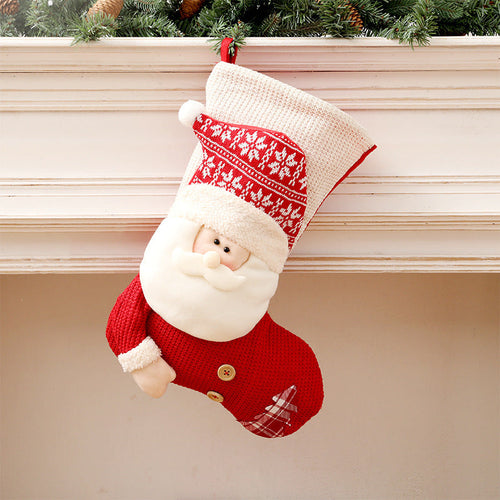 Knitted Christmas stocking featuring Santa design, perfect for festive baby decor. Angle view 10.