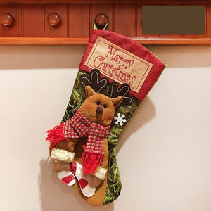 Christmas stocking featuring Santa and snowman decor, perfect for festive baby room decorations.