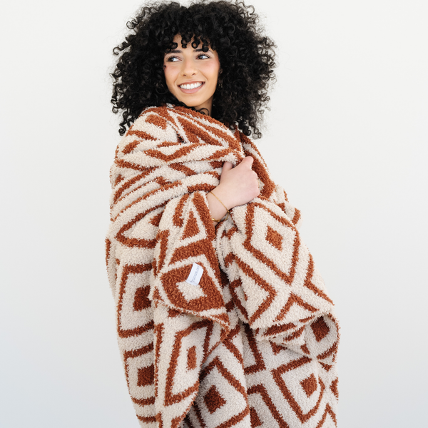 Cozy DOUBLE-LAYER BAMBONI® throw blanket for babies, perfect for swaddling and keeping warm.