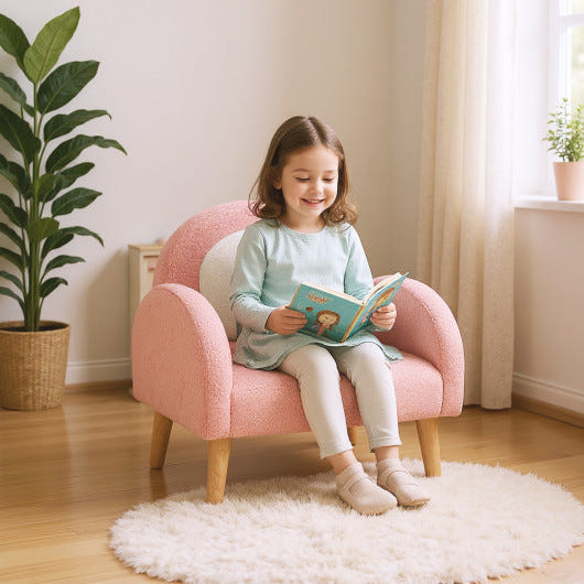 Kids pink armchair with comfy backrest and armrests, perfect for children's seating and playtime.
