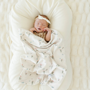 Soft Minky Stretch Receiving Blankets in various colors, perfect for swaddling and keeping your baby cozy.