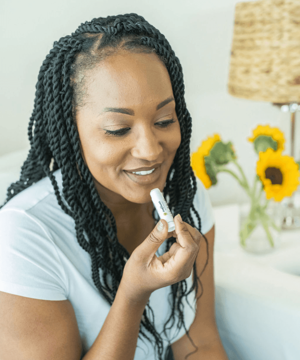 Natural baby lip balm in a cute container, perfect for softening and protecting delicate lips.