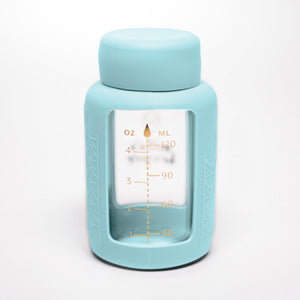 Set of 2 glass breast milk bottles at a 47-degree angle for safe and stylish milk storage.