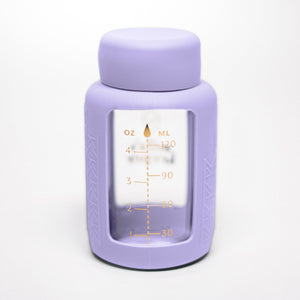 Set of 2 glass breast milk bottles at a 55-degree angle for safe and stylish milk storage.