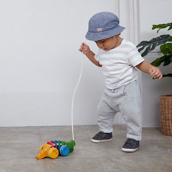 Rainbow Alligator toy in vibrant colors, perfect for baby playtime and entertainment. Angle 2 view.