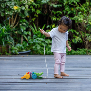 Colorful Rainbow Alligator toy for babies, perfect for playtime and entertainment. Angle 4 view showcasing its vibrant design.