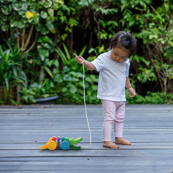 Colorful Rainbow Alligator toy for babies, perfect for playtime and entertainment. Angle 4 view showcasing its vibrant design.