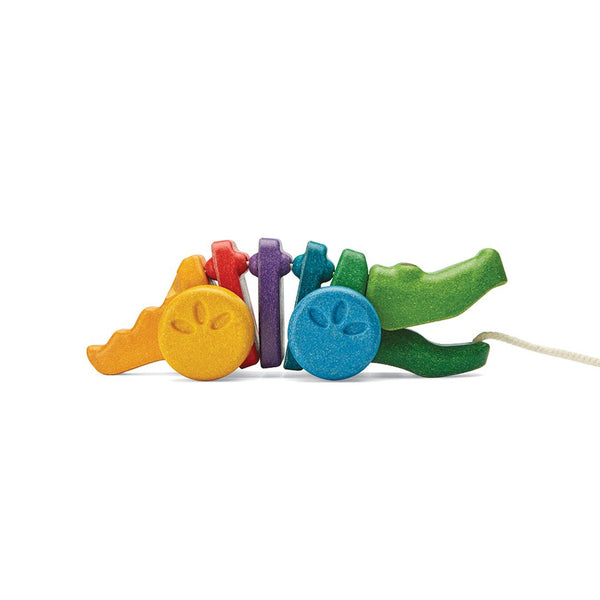 Colorful Rainbow Alligator toy for babies, perfect for playtime and entertainment at any angle.