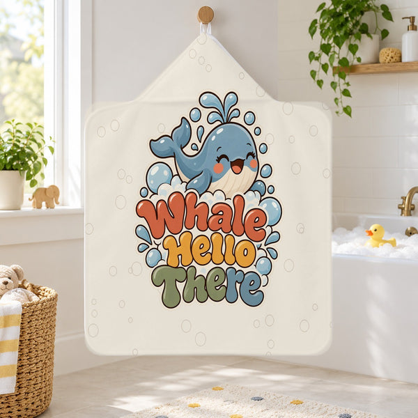 Whale Hello There kids hooded bath towel hanging in a kids bathroom