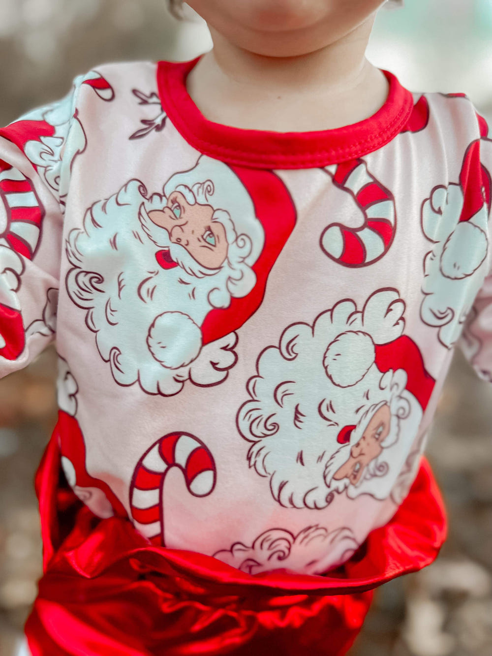 Candy cane Santa romper for babies, festive holiday outfit, perfect for Christmas celebrations.