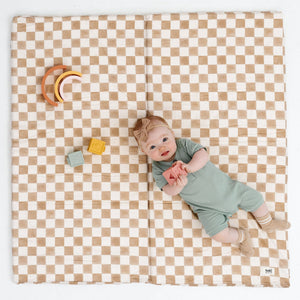 Checker Toffee Organic Cotton Mat for babies, showcasing a soft, stylish play surface from angle 2.