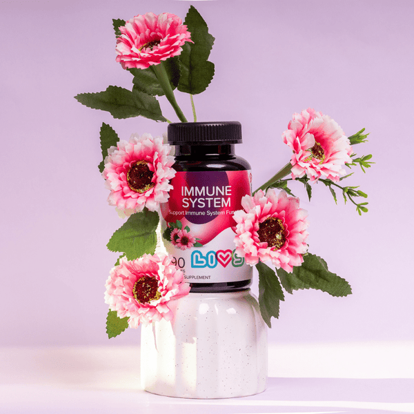 "Raspberry baby immune system booster supplement in a bottle, angled view showcasing vibrant packaging."