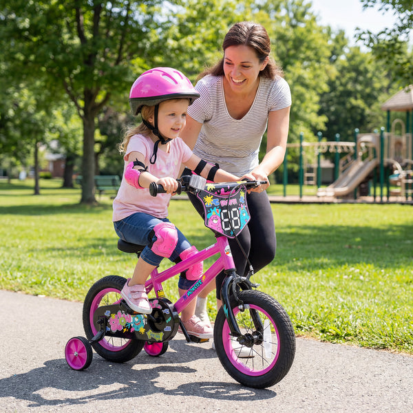 12-inch pink kids bike with training wheels for ages 3-4, featuring street art design, angled view.