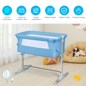 Portable baby bed side sleeper bassinet crib with carrying bag, angled view for travel convenience.