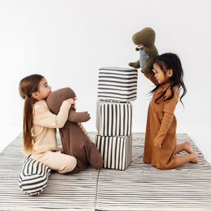 Bold Stripe Play Cube in vibrant colors, showcasing its playful design from an angled view. Perfect for baby playtime!
