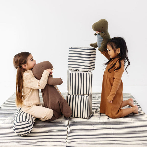 Bold Stripe Play Cube in vibrant colors, showcasing its playful design from an angled view. Perfect for baby playtime!