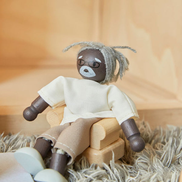 Grandfather dollhouse figure with dark skin tone for imaginative pretend play, shown at angle 6.