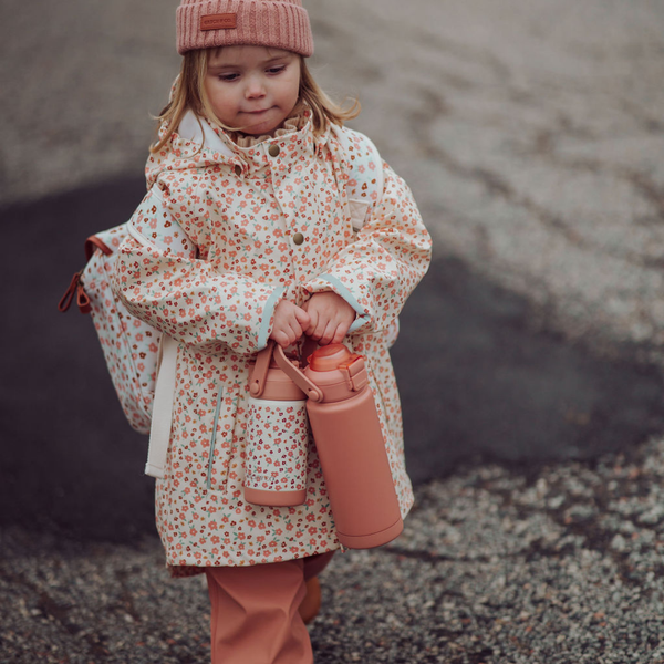 Fishtail Rain Jacket in Sunset Meadow design, angle view showcasing vibrant colors and stylish fit for babies.