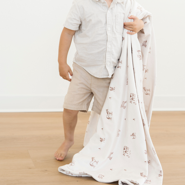 Minky stretch receiving blankets in soft colors, perfect for swaddling and keeping your baby cozy.
