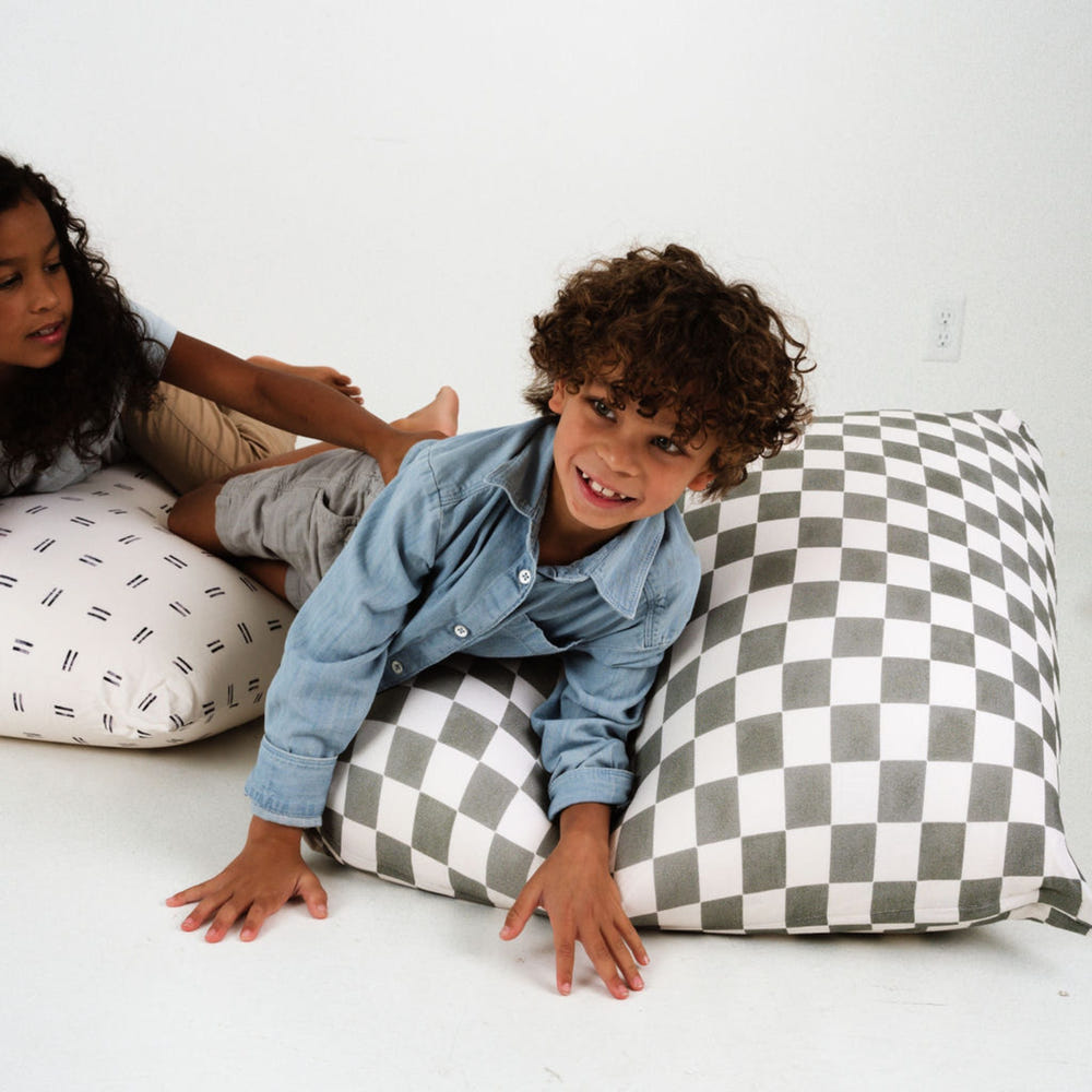 Checker Pepper Bean Bag for babies, offering comfort and style in a cozy seating solution.