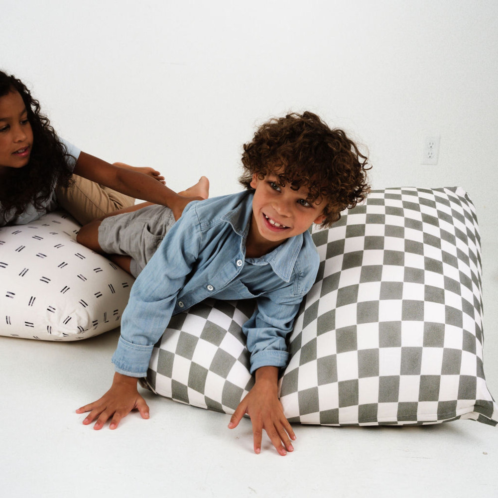 Checker Pepper Bean Bag for babies, offering comfort and style in a cozy seating solution.