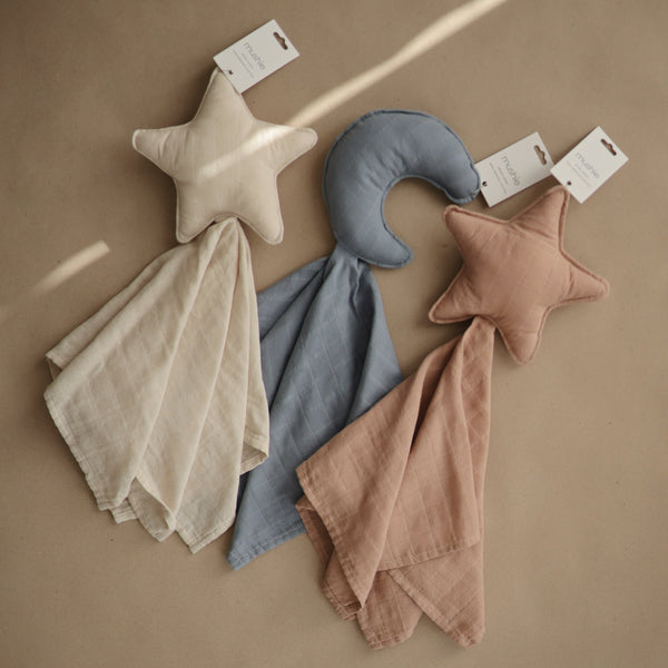 Moon Lovey Blanket in soft fabric, angled view showcasing its adorable design for comforting babies.