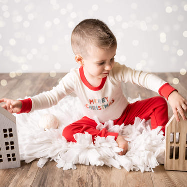 Cozy Christmas pajamas for babies featuring festive designs and soft fabric. Perfect for holiday snuggles!